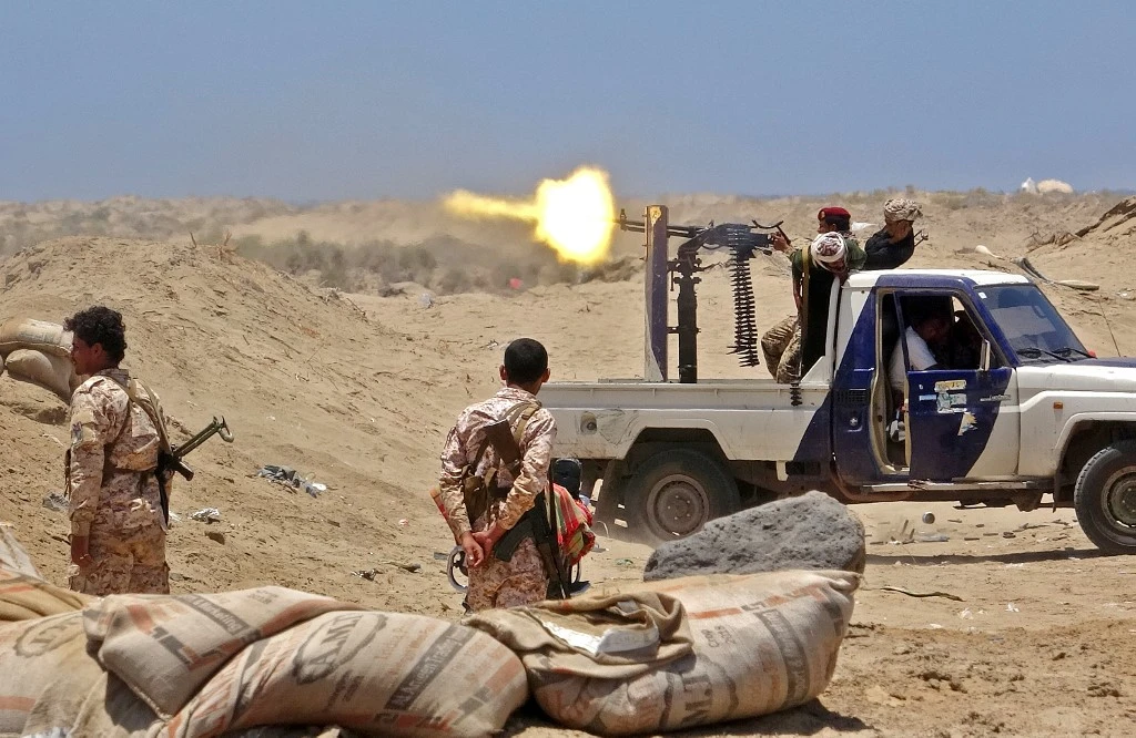 Fighters from of the Southern Transitional Council (STC) fire towards the positions of government forces during clashes in the Sheikh Salim area in the southern Abyan province on May 11, 2020. (AFP)