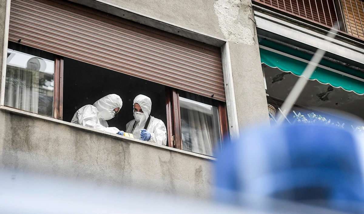 Forensic police officers at work after being called to the Silvia Romano family apartment in Milan, Wednesday, May 13, 2020 after a glass bottle was thrown against the building. A right-wing lawmaker was reprimanded Wednesday for having called a young Italian woman held hostage in Somalia by Muslim extremists a neo-terrorist after she returned home having apparently converted to Islam. (AP)