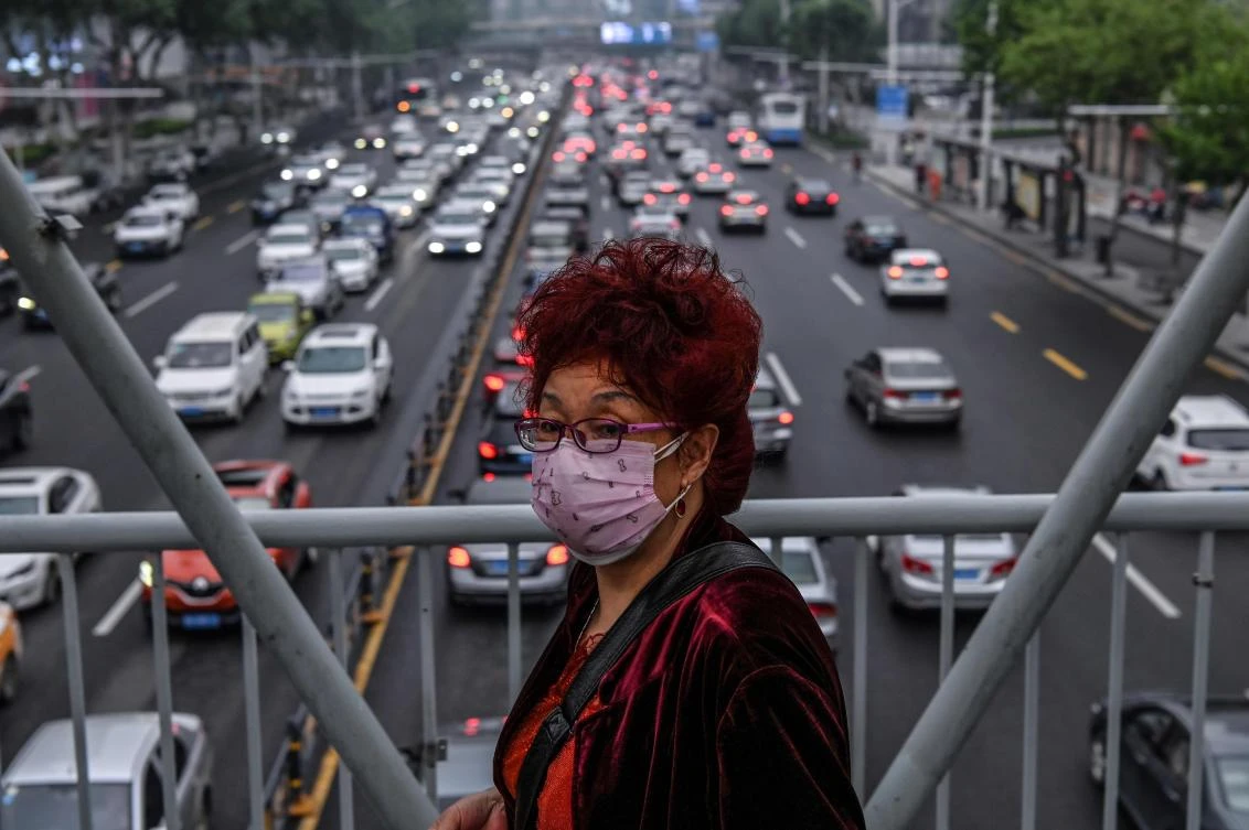 Wuhan in China’s Hubei province, where the virus emerged last year, vehicles once again clog the city’s highways and roads as life returns to normal, above. (AFP)
