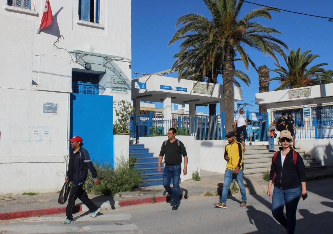 People leave a train station, as Tunisia relaxes some of its lockdown rules while keeping other restrictions in place, as preventive measures against the spread of COVID-19, in La Marsa, Tunisia. (File/Reuters)