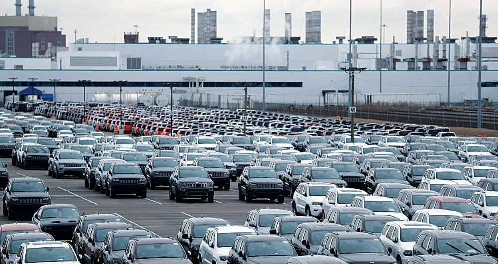 Auto workers’ tenuous return offers ray of hope in jobs crisis