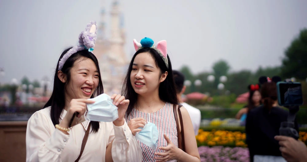 Visitors at Shanghai Disney Resort. Easing of travel restrictions will push up China’s fuel consumption. (Reuters)
