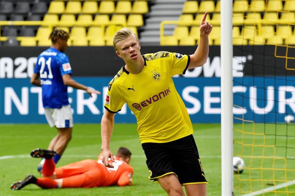 Borussia Dortmund's Erling Braut Haaland celebrates scoring their first goal as play resumes behind closed doors following the outbreak of the coronavirus disease (COVID-19). (Reuters)