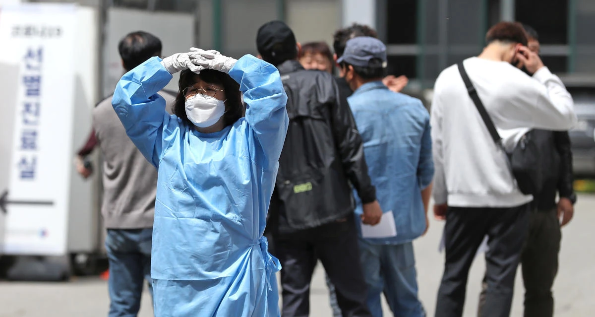 After weeks of a slowdown of new cases, South Korea’s daily jump marked an average of about 30 for several days. (Yonhap via Reuters)
