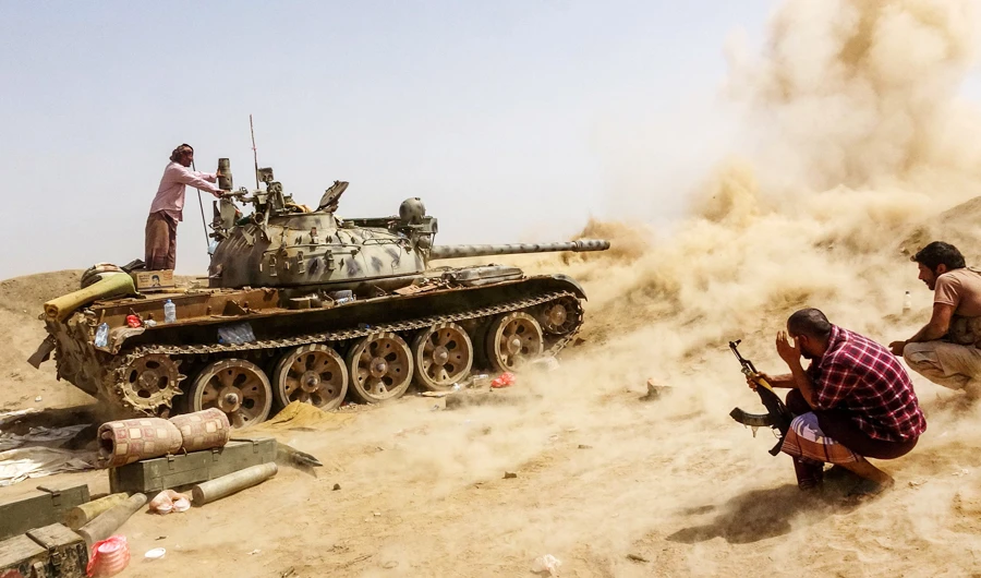 A tank belonging to forces loyal to Yemen's Southern Transitional Council (STC) separatists fires while on the frontline of clashes with pro-government forces for control of Zinjibar, the capital of the southern Abyan province, on its eastern outskirts in the Sheikh Salim area, on May 15, 2020. (AFP)