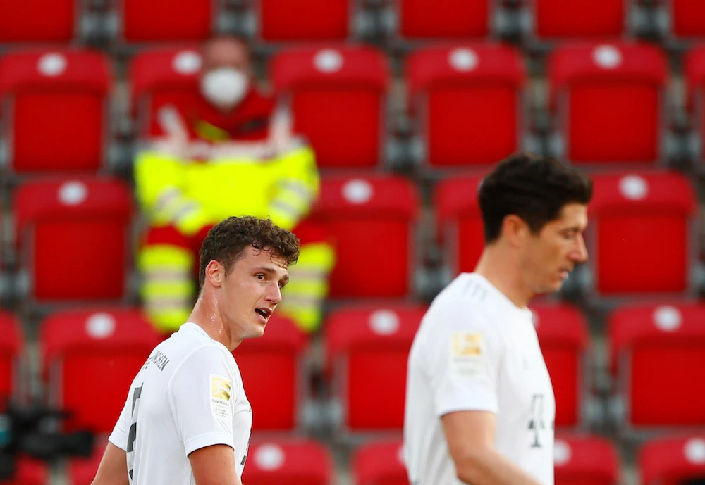 Bayern Munich's French defender Benjamin Pavard (L) celebrates scoring their second goal with Bayern Munich's Polish forward Robert Lewandowski during the German first division Bundesliga football match FC Union Berlin v FC Bayern Munich on May 17, 2020 in Berlin. (AFP)