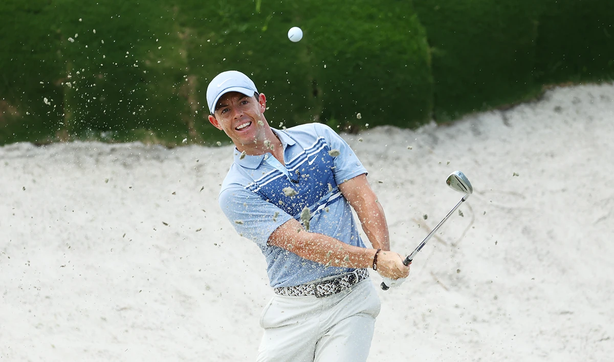 Rory McIlroy of the American Nurses Foundation team plays a shot from a bunker on the second hole on Sunday. (AFP)