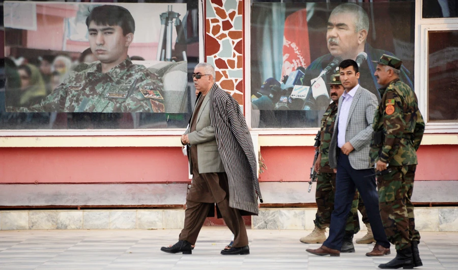 Afghan Vice President Abdul Rashid Dostum, left, walks at his headquarters in Sheberghan on July 28, 2016. (Files/AFP)