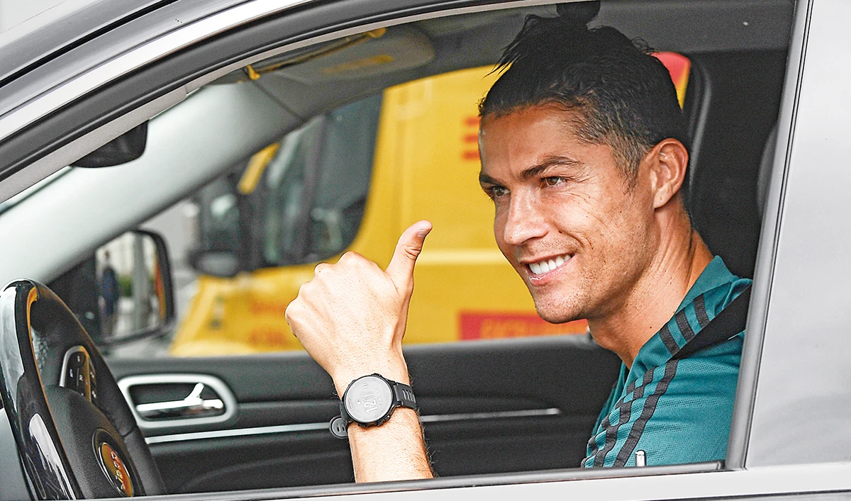 Cristiano Ronaldo leaves the Juventus sports center after his first training in Turin on Tuesday. (AP)