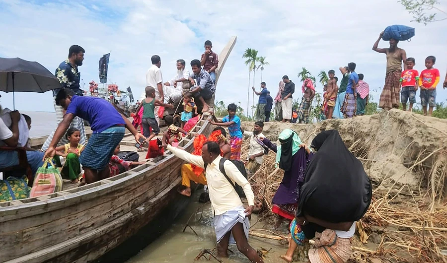 This photo release from the District Administration of Bhola shows residents being evacuated in Dhalchar village as the Cyclone Amphan barrels towards Bangladesh’s coast. (AFP)