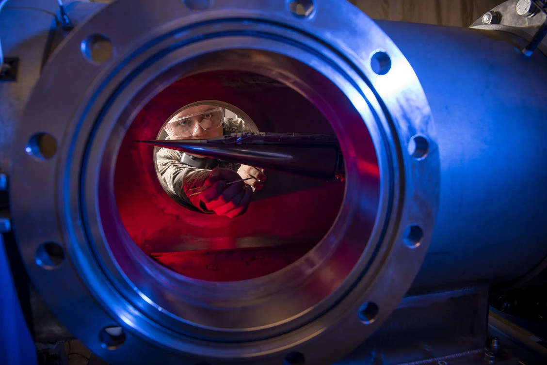 A cadet uses a Ludwieg tube to measure the pressures, temperatures, and flow field of various basic geometric and hypersonic research vehicles at Mach 6 at the US Air Force Academy in Colorado Springs, Colorado. (US Air Force Academy file photo via AP)