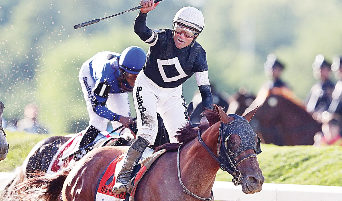 Joel Rosario on Sir Winston celebrates after winning the 151st running of the Belmont Stakes at Belmont Park in Elmont, New York in this June 28, 2019 file photo. (AFP)