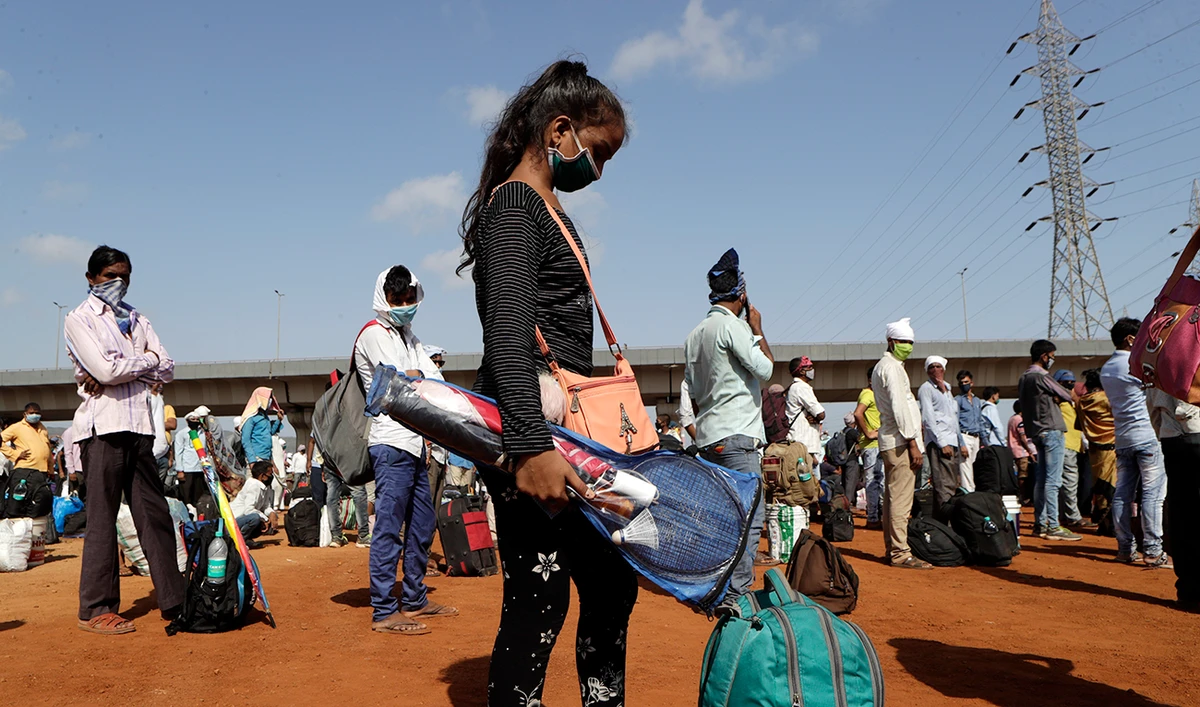 COVID-19 cases rise in India as migrant workers return home from cities