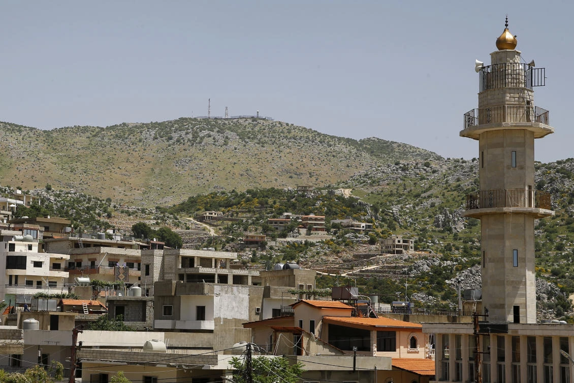 An Israeli military position on a hill on the top of Mount Hermon in the Israeli-controlled Golan Heights is seen from Kfar Chouba village, where the borders between Israel, Syria and Lebanon meet, in southeast Lebanon, Wednesday, May 20, 2020. (AP)