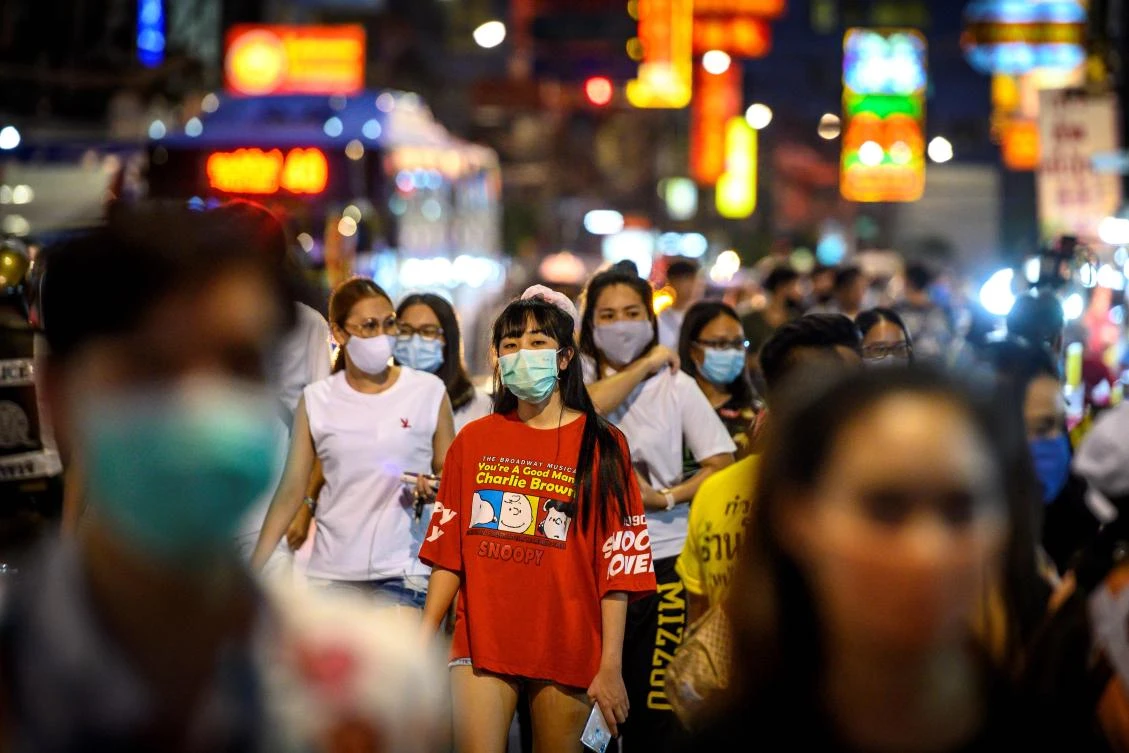 Thailand has continued easing restrictions related to coronavirus by allowing various businesses to reopen. Above, pedestrians walk on the main street of Chinatown in Bangkok on May 21, 2020. (AFP)