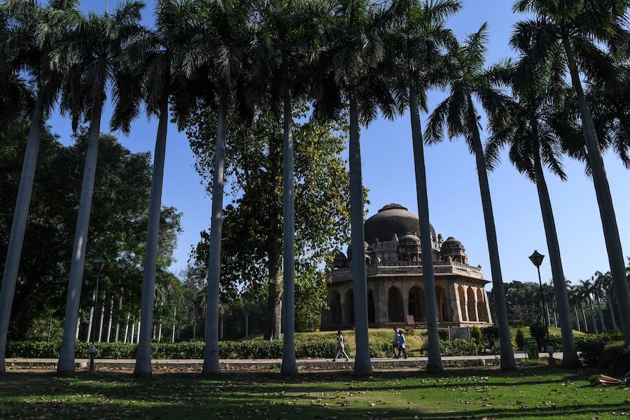 People go for a morning walk at Lodhi Garden in New Delhi on May 21, 2020. (AFP)
