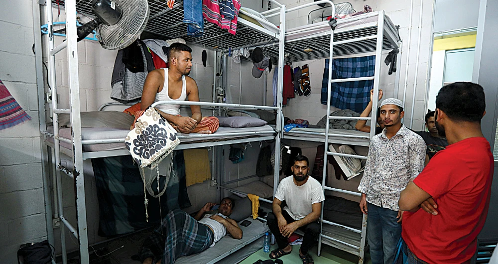 Migrant workers from Bangladesh, working for waste management company RAMCO, inside their dormitory at a company facility in Biakout, near Beirut, Lebanon. The dollar crisis has affected migrant labor especially badly in Lebanon. (Reuters)