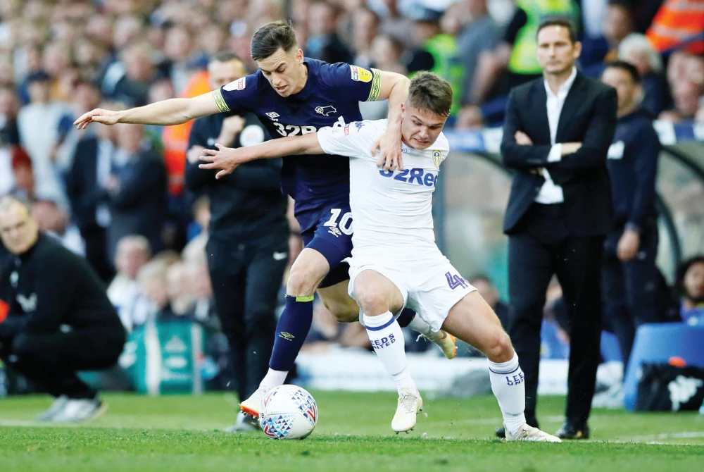 Mateusz Klich and Derby County’s Tom Lawrence during a match between Leeds United and Derby County at Elland Road, Leeds. (Reuters/File)
