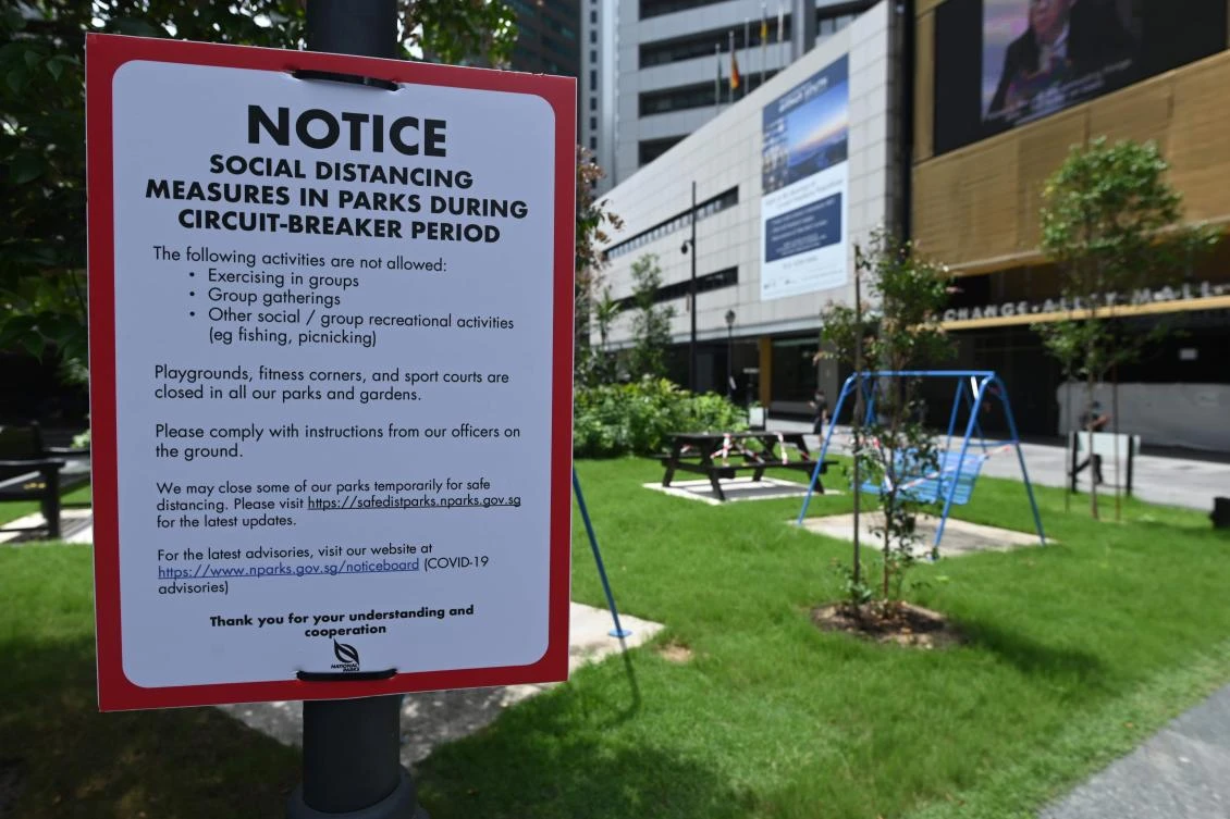 A notice of social distancing measures to halt the spread of coronavirus is installed at Raffles Place in Singapore on May 22, 2020. (AFP)
