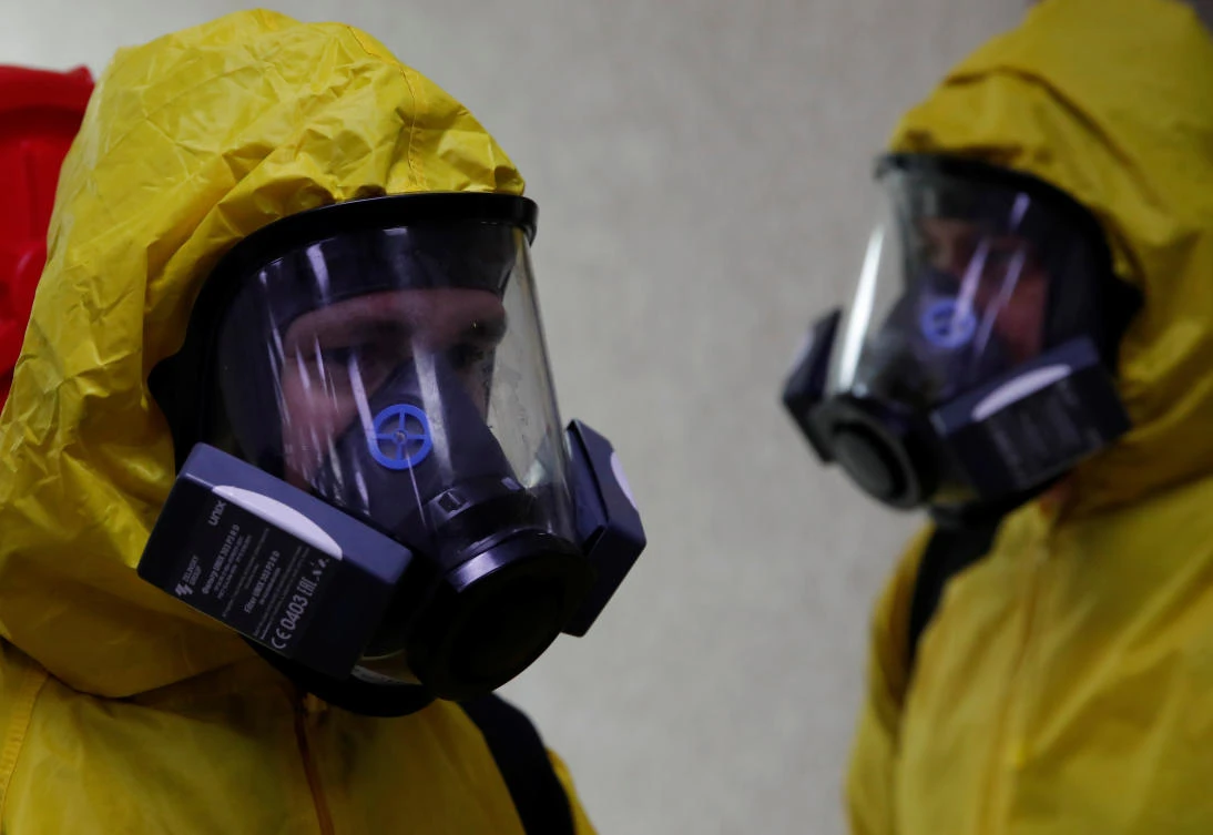 Above, members of Russia’s emergencies ministry disinfect the Leningradsky railway station in Moscow on May 19, 2020. (Reuters)