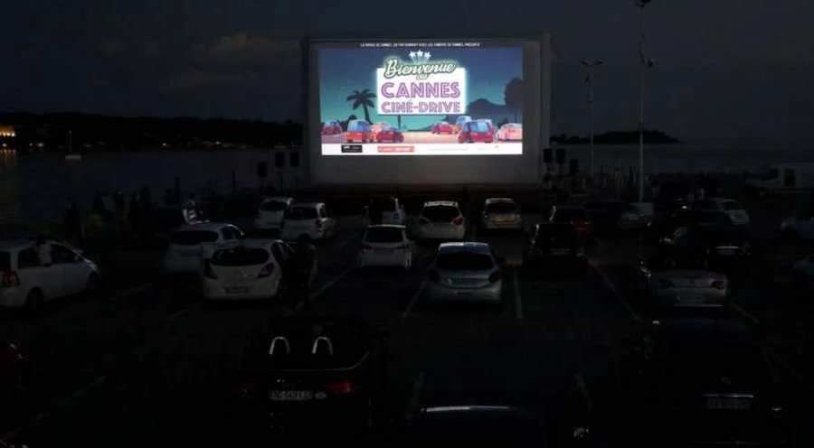 People at a drive-in cinema Photograph. (Reuters)