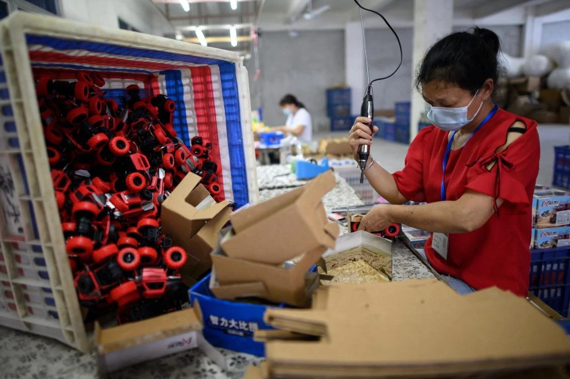 Gearing toward the China market may not yield immediate results. Above, a worker assembles toy cars at a factory in southern China’s Guangdong province. (AFP)
