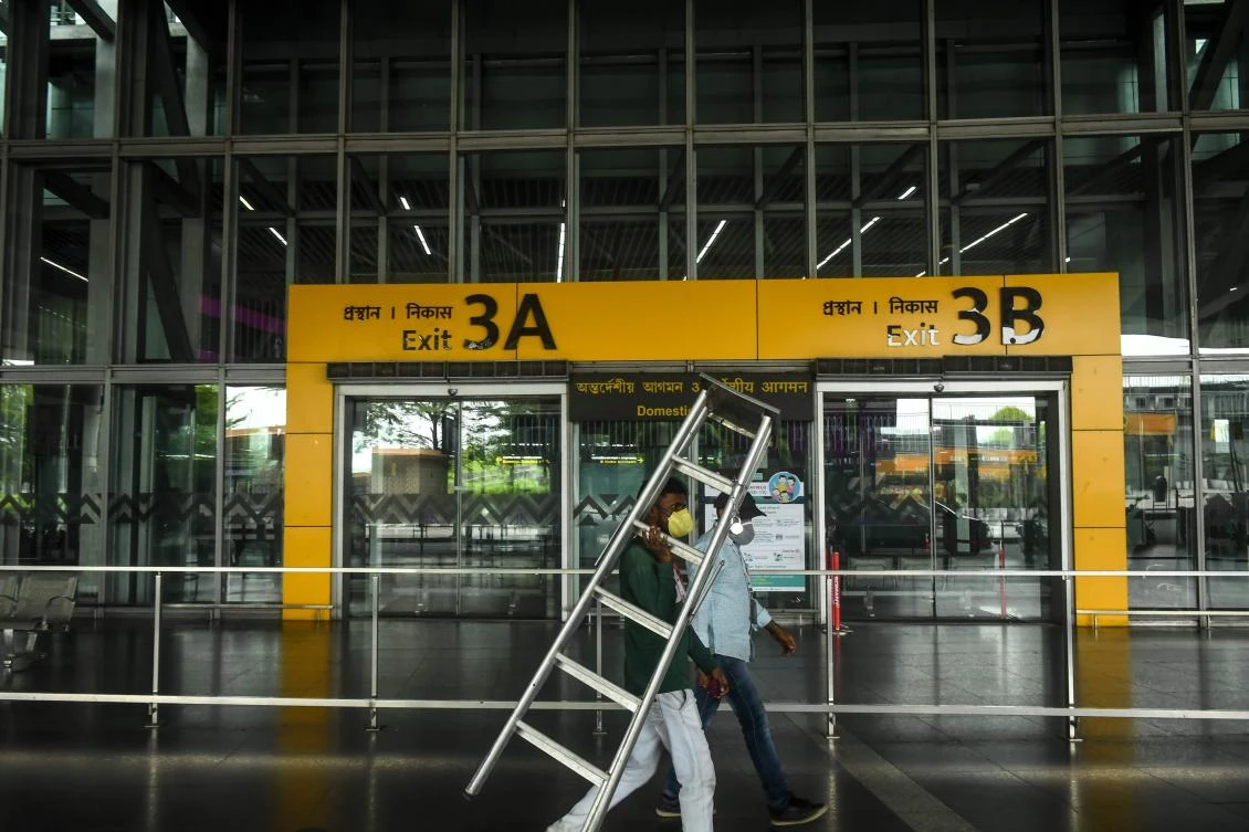 India’s state government officials say they are not prepared to open for flights amid rising coronavirus cases. Above, a laborer at Kolkata Airport on May 24, 2020. (AFP)