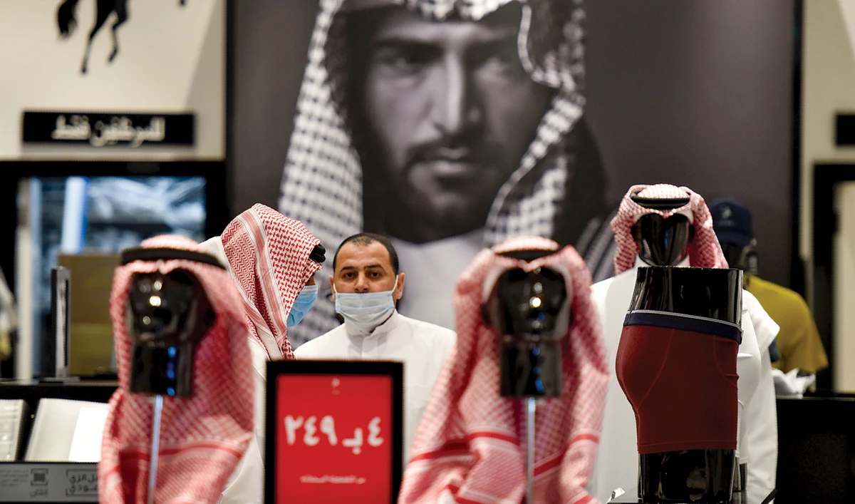 A man at a store in Riyadh. The Kingdom has firmly addressed the virus issue. (AFP)