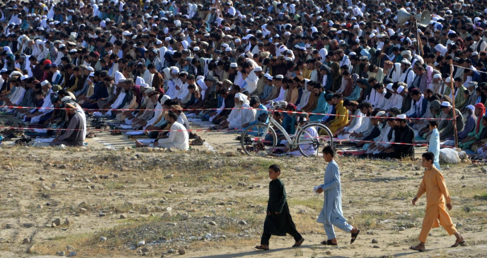 Muslim devotees offer prayers at the start of the Eid al-Fitr festival in Jalalabad. (AFP)