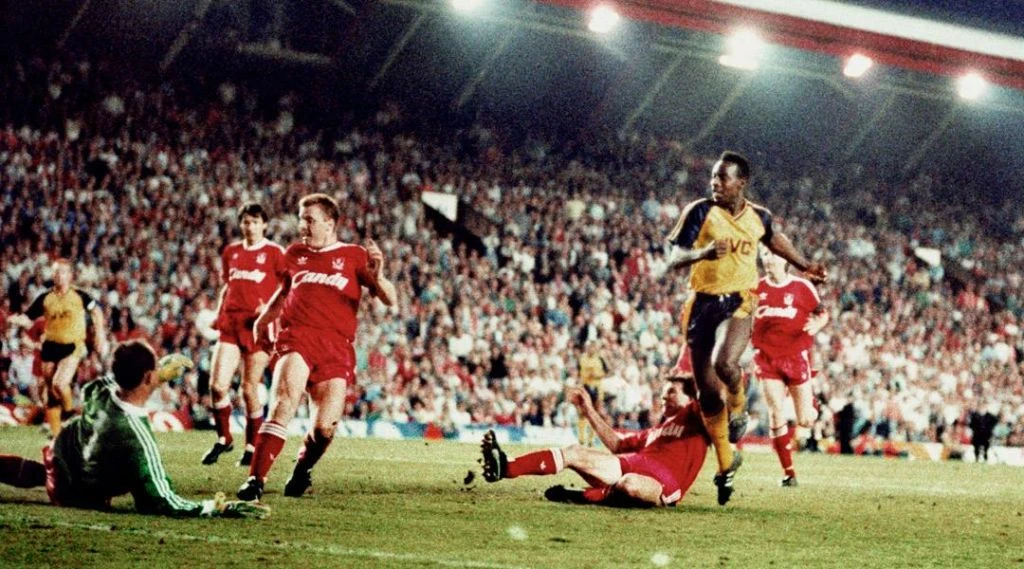 “It’s up for grabs now,” commentator Brian Moore famously said as Michael Thomas broke away from the Liverpool defence to tap the ball past Bruce Grobbelaar. (AFP)
