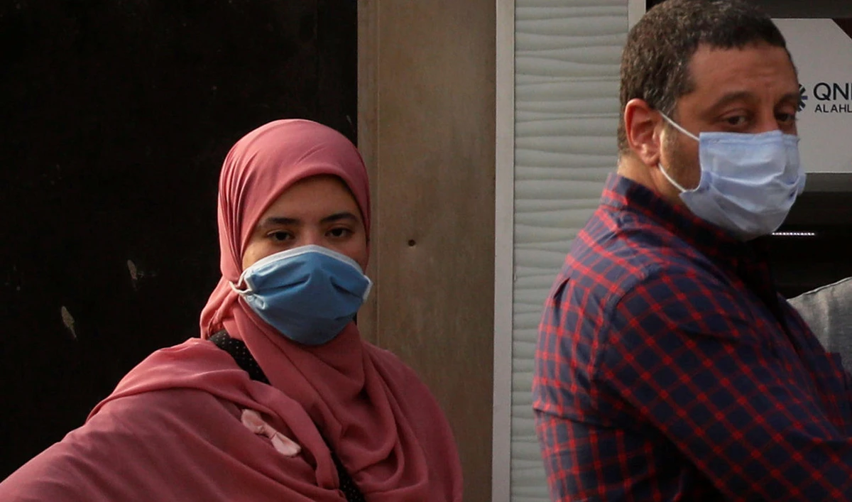 People are pictured wearing protective face masks, amid concerns over the coronavirus disease (COVID-19), in Cairo, Egypt. (Reuters)