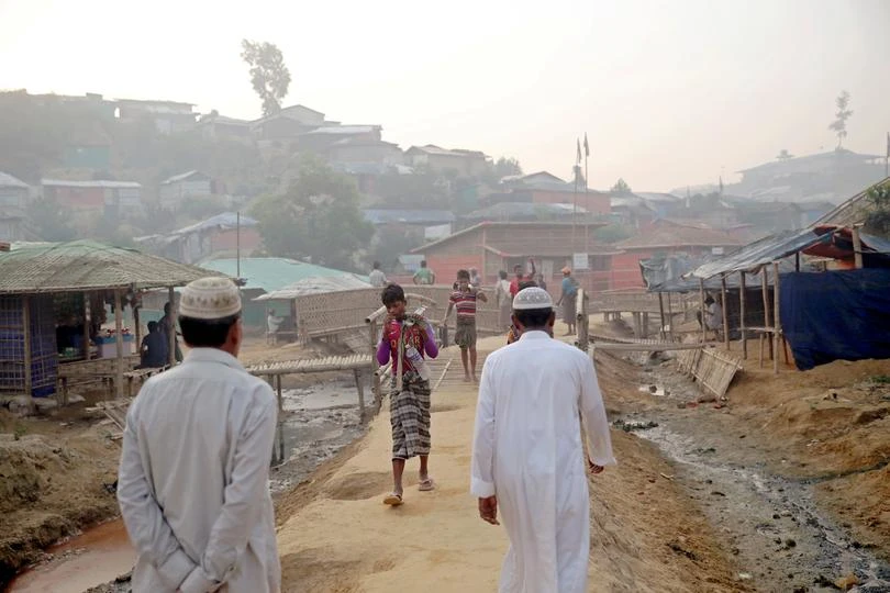 Rohingya refugees walk on a road at the Balukhali camp in Cox’s Bazar, Bangladesh. (Reuters)