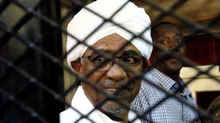 Sudan's former president Omar Hassan al-Bashir smiles as he is seen inside a cage at the courthouse, in Khartoum, Sudan August 31, 2019. (Reuters)