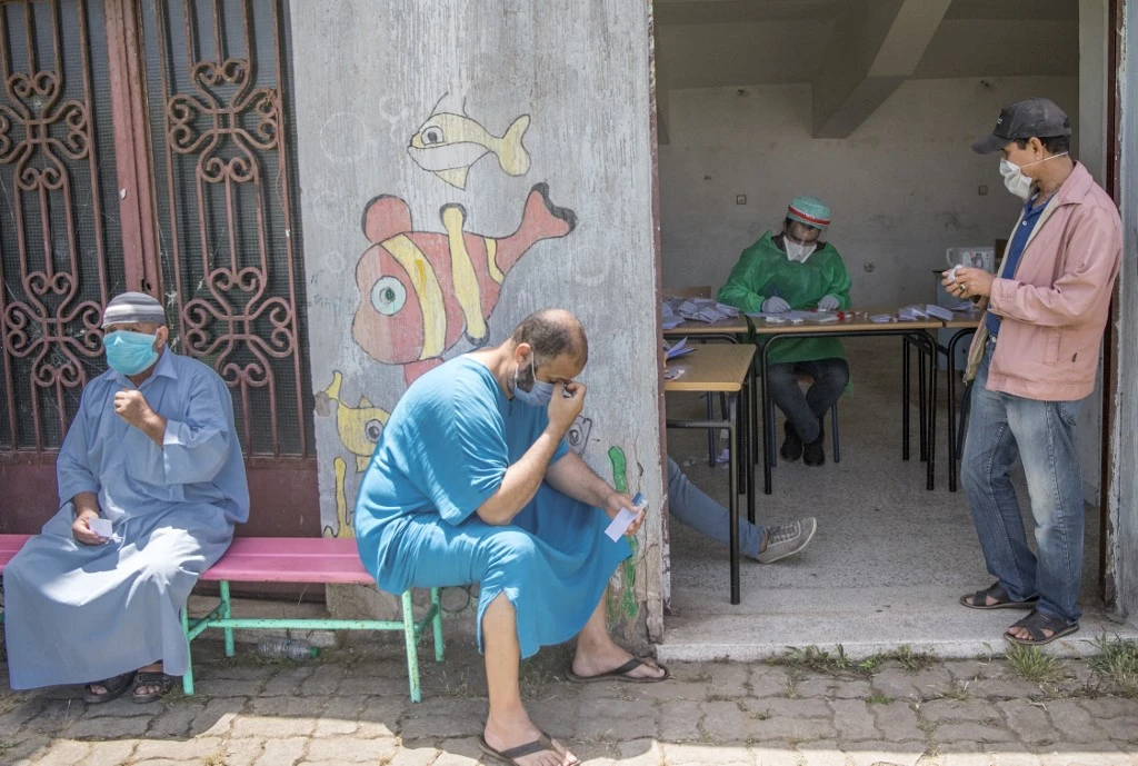Taxi drivers wait before getting tested for COVID-19 coronavirus disease in Morocco's capital Rabat on May 27, 2020. (AFP)