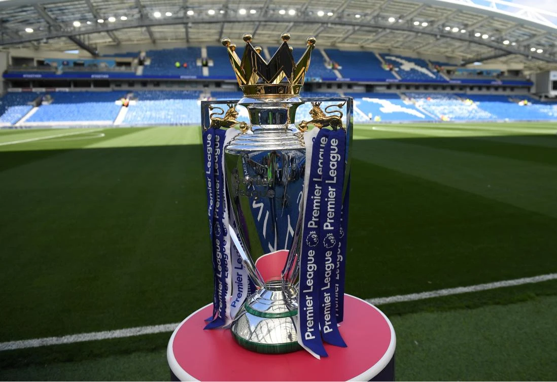 The Premier league trophy sits beside the pitch ahead of the English Premier League football match between Brighton and Hove Albion and Manchester City at the American Express Community Stadium. (AFP/File Photo)