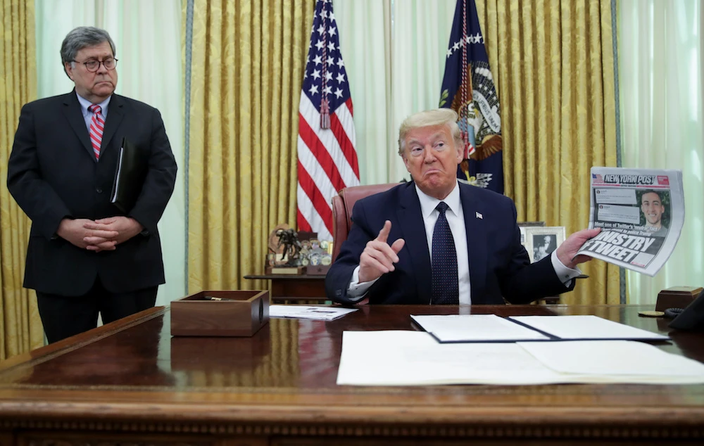 Donald Trump and Attorney General Bill Barr in the Oval Office shortly before the US president signed an executive order targeting social media companies. (Reuters)