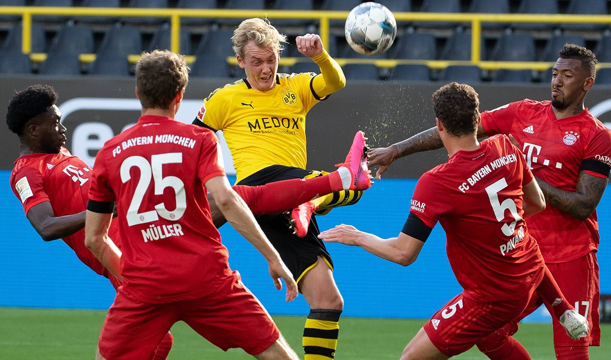 Borussia Dortmund’s German forward Julian Brandt, center, in action during the Bundesliga match against FC Bayern Munich on Tuesday. (AFP)