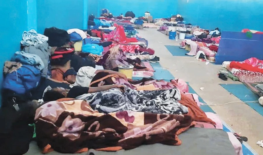Migrants resting on the floor of a detention center, amidst concerns over the spread of COVID-19 in the city of Zawiya, Libya. (Reuters)