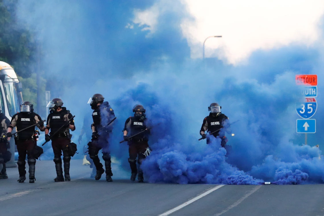 Law enforcement officers take position during a protest against the death in police custody of George Floyd in Minneapolis, Minnesota on May 30, 2020. (Reuters)