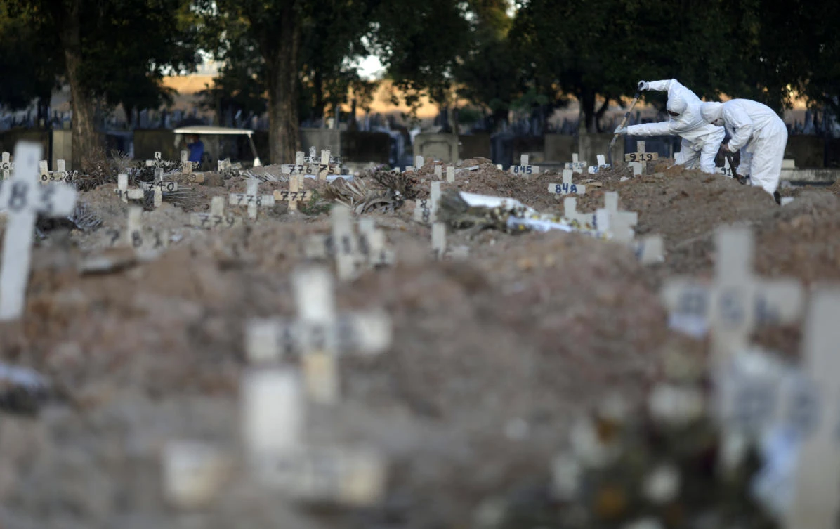 The number of coronavirus fatalities in Brazil nears 30,000. Above, gravediggers bury the body of a person who died from the disease in Rio de Janeiro on May 29, 2020. (Reuters)