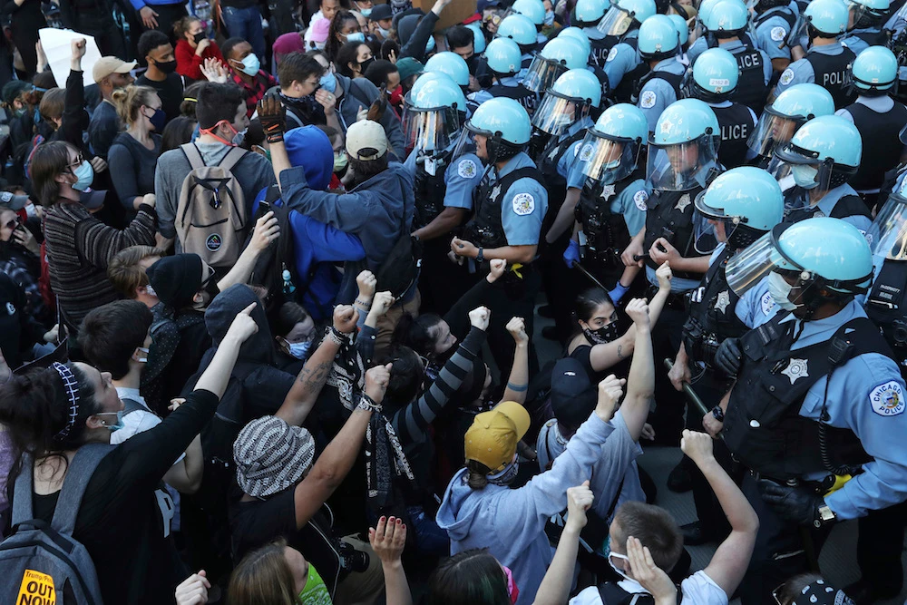 Protests were held in US cities over the death of Floyd, a black man who died after being restrained by Minneapolis police officers on May 25. (John J. Kim/Chicago Tribune via AP)