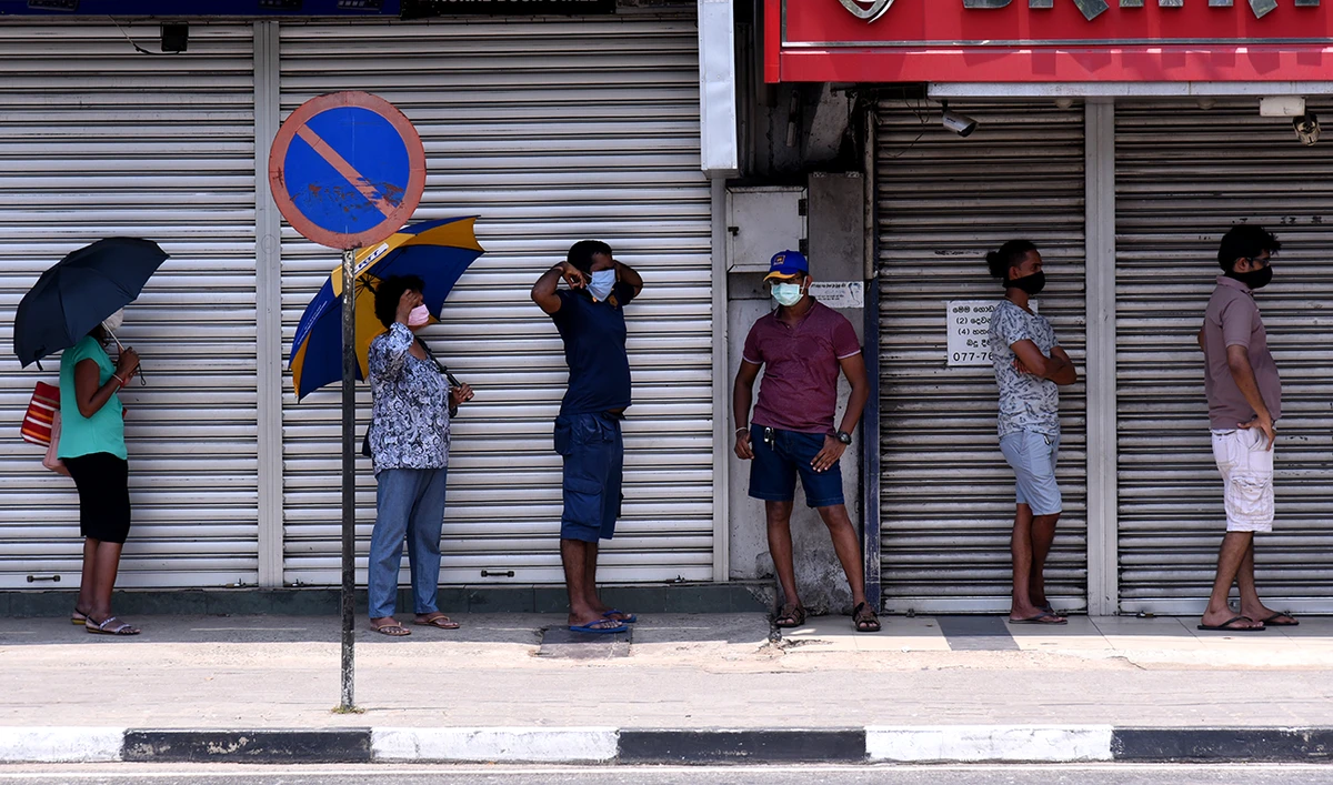 People wearing facemasks outside a shop in Colombo, Sri Lanka. (Shutterstock)