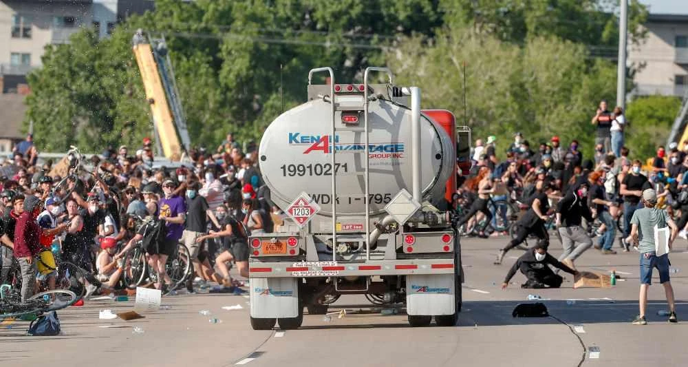 A tanker truck drives into thousands of protesters marching on 35W north bound highway in Minneapolis, Minnesota, on May 31 during a protest against the death in Minneapolis police custody of George Floyd. (REUTERS/Eric Miller)
