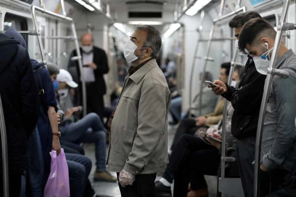 Iranians wear protective face masks as they travel on the metro in Tehran on May 20, 2020. (West Asia News Agency/Ali Khara via REUTERS)