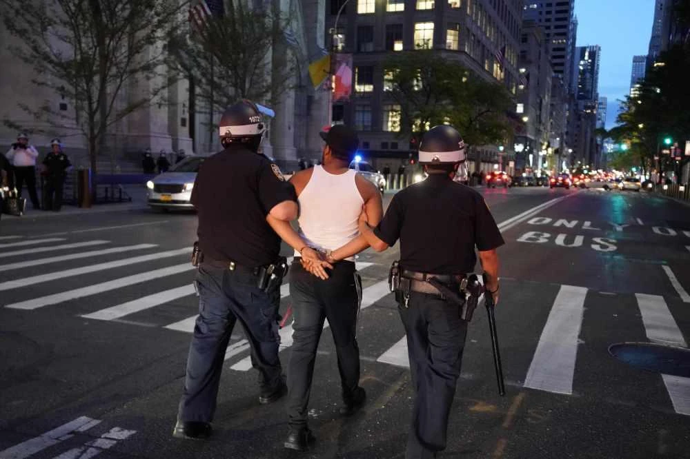 A person is arrested as he walks down 5th Avenue near St. Patricks on June 1, 2020, during a "Black Lives Matter" protest. (AFP / TIMOTHY A. CLARY)