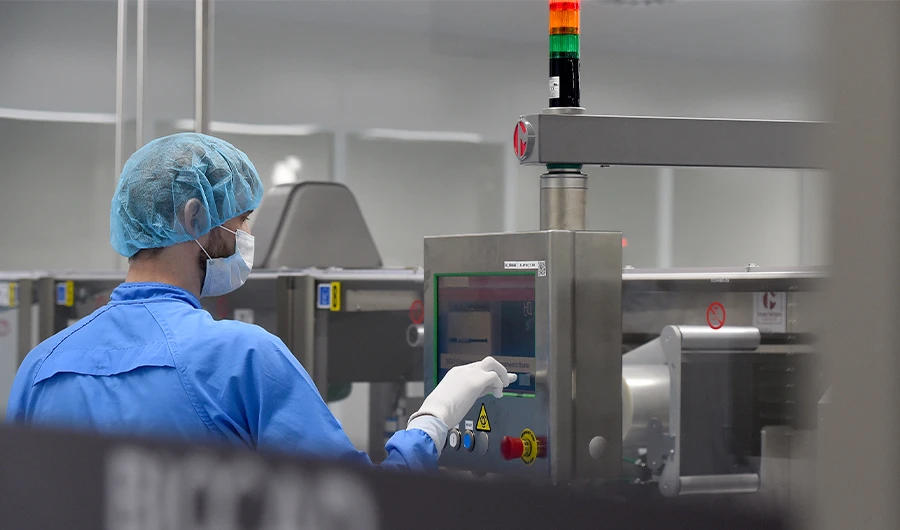An employee wearing protective equipment works at the production line of Russia's biotech company BIOCAD, which is developing its own vaccine against the new coronavirus and working on another one in cooperation with the country's virus research centre in Siberia, Vektor, in Strelna on May 20, 2020. (AFP)