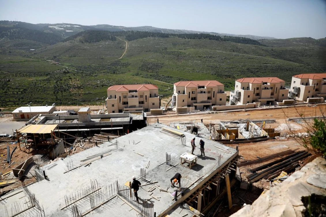 Labourers work at a construction site in the Israeli settlement of Beitar Illit in the Israeli-occupied West Bank April 7, 2019. (Reuters)