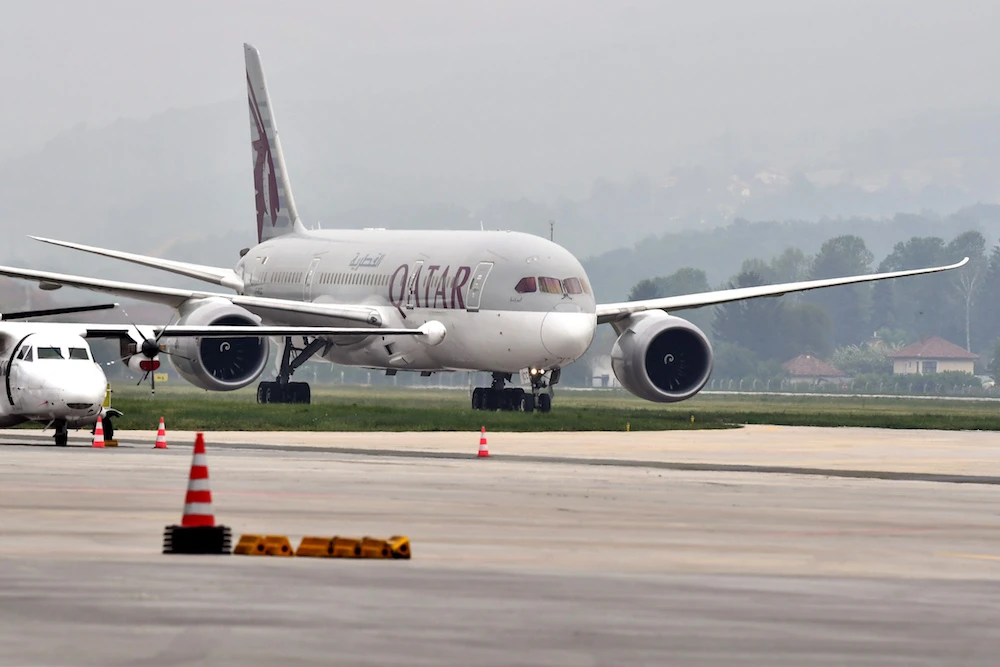The Greek civil protection authority said 12 out of 91 people on a Qatar Airways flight that arrived on Monday had tested positive for COVID-19. (File/AFP)
