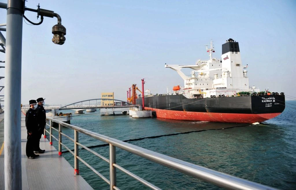 Oil prices are being propped by a continuing recovery in China. Above, a Kuwaiti oil tanker unloads crude oil at the port in Qingdao, in China’s eastern Shandong province. (AFP )