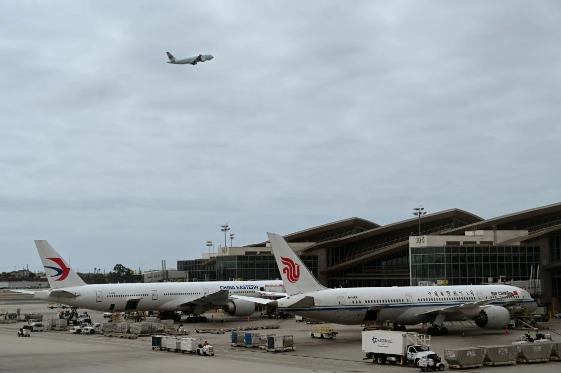 Air China and China Eastern planes wait at the gates at Los Angeles International Airport. (File/AFP)